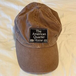 The American Quarter Horse brown ball cap. Adjustable leather strap. Unisex.